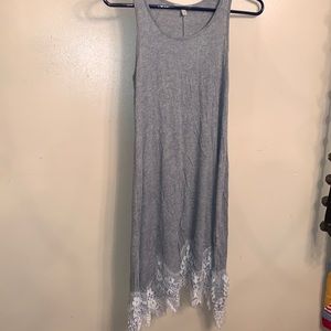 Grey dress with white lace material at the bottom